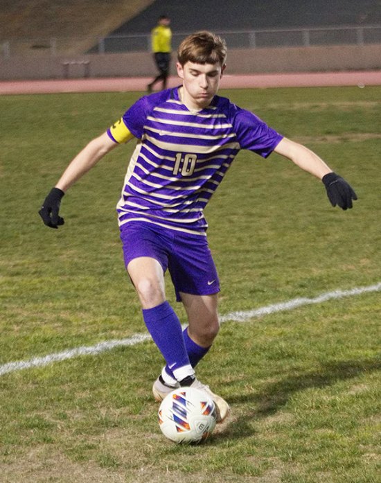 Lemoore Team Captain Christian Sanchez moves the ball in Tuesday's soccer loss to Lompoc in Tiger Stadium.